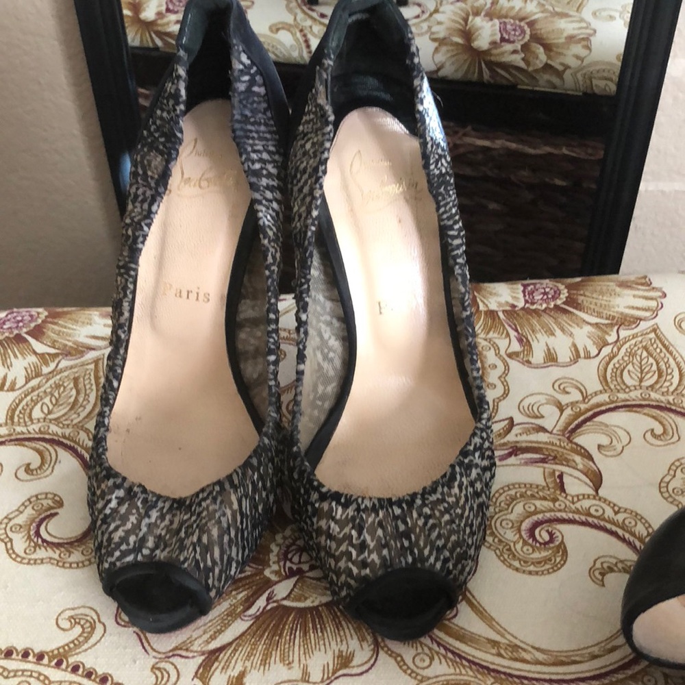 Christian Louboutin peep toe heel.